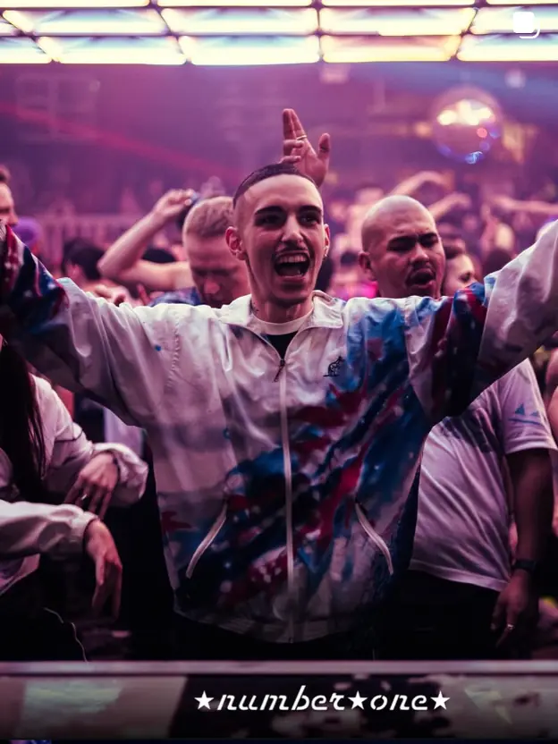 Ninho in the crowd at Number One, arms wide open, shouting